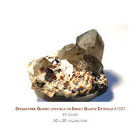 spessartine garnet crystals on quartz